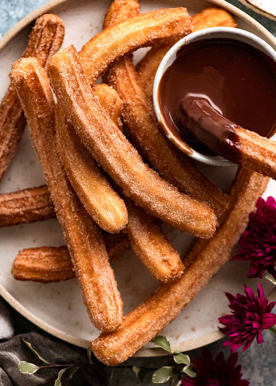 Plate of Churros recipe with chocolate dipping sauce 