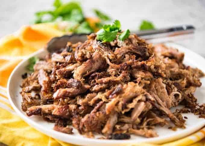 Mexican Pulled Pork Carnitas - Mouth wateringly delicious, this pork is juicy, moist, perfect seasoned with the ultimate golden brown crunchy bits! recipetineats.com