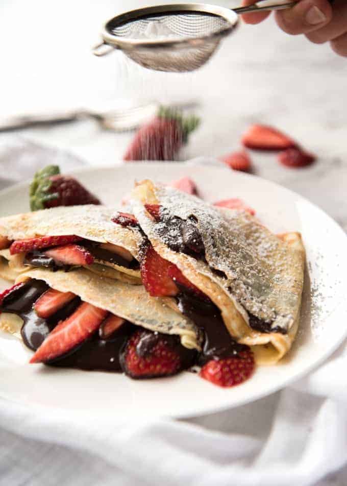 Nutella Crepes with Strawberries - The batter is a 10 second job when made with a blender! And you do not need a crepe pan, just a skillet! recipetineats.com