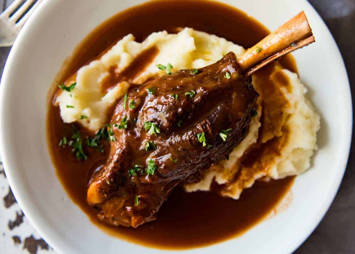 Port Braised Lamb Shanks - easy to make slow cooked lamb shanks in an incredible port wine sauce! www.recipetineats.com