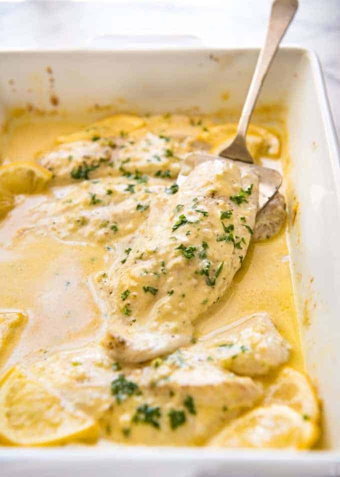 This Baked Fish with Lemon Cream Sauce is all made in one baking dish! Dinner on the table in 15 minutes. www.recipetineats.com