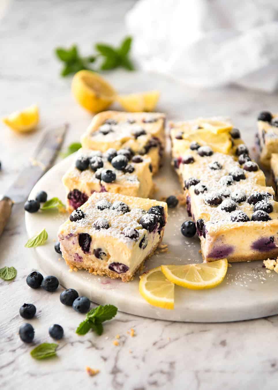 These Blueberry Cheesecake Bars are light yet creamy and luscious. Filled with soft blueberries, this is a baked cheesecake that's so easy to make! www.recipetineats.com