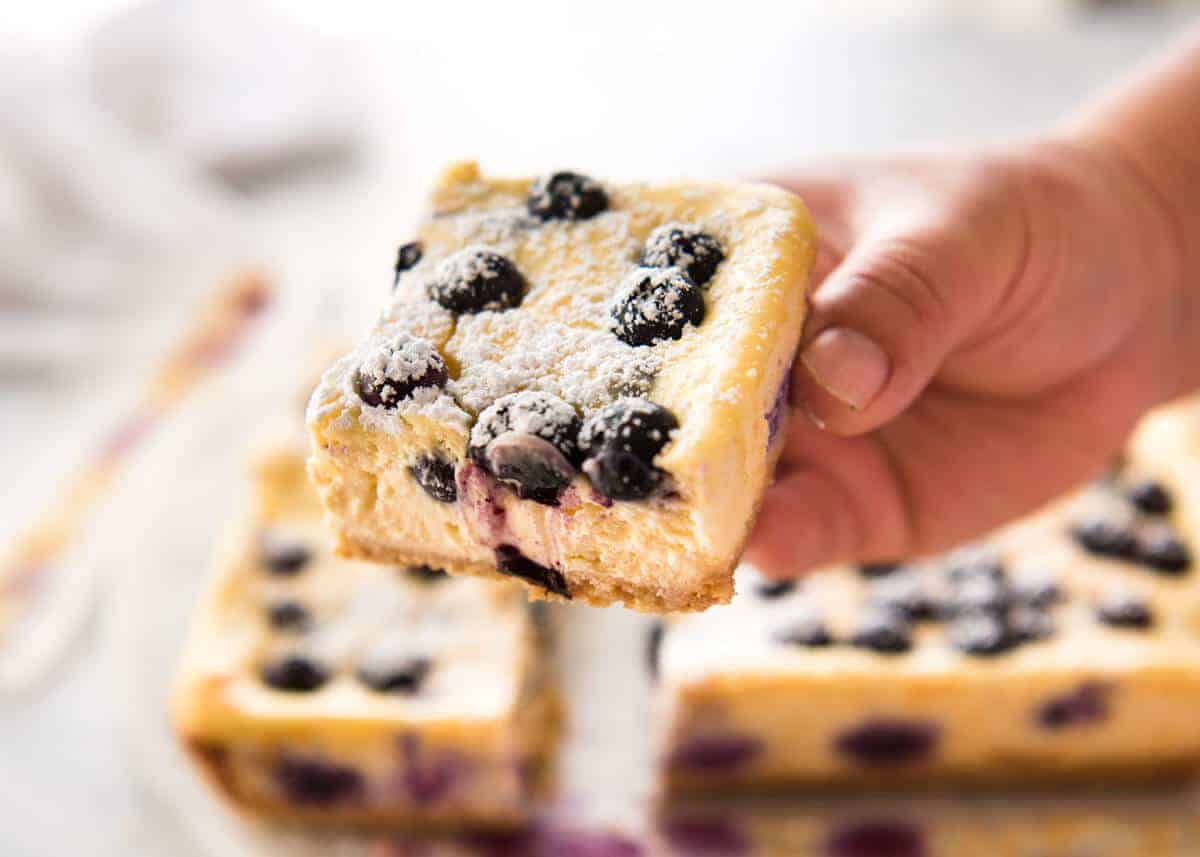 These Blueberry Cheesecake Bars are light yet creamy and luscious. Filled with soft blueberries, this is a baked cheesecake that's so easy to make! www.recipetineats.com