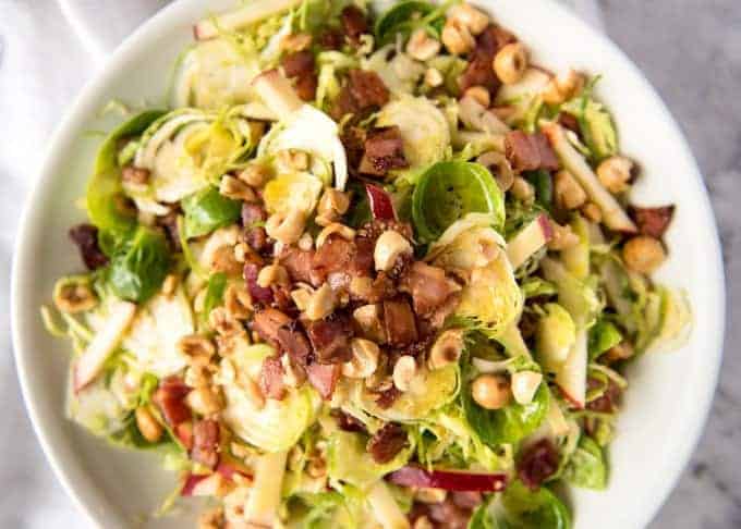 Brussel Sprout Salad - the combination of brussels sprouts, bacon, apple and hazelnuts is a magical combination! recipetineats.com