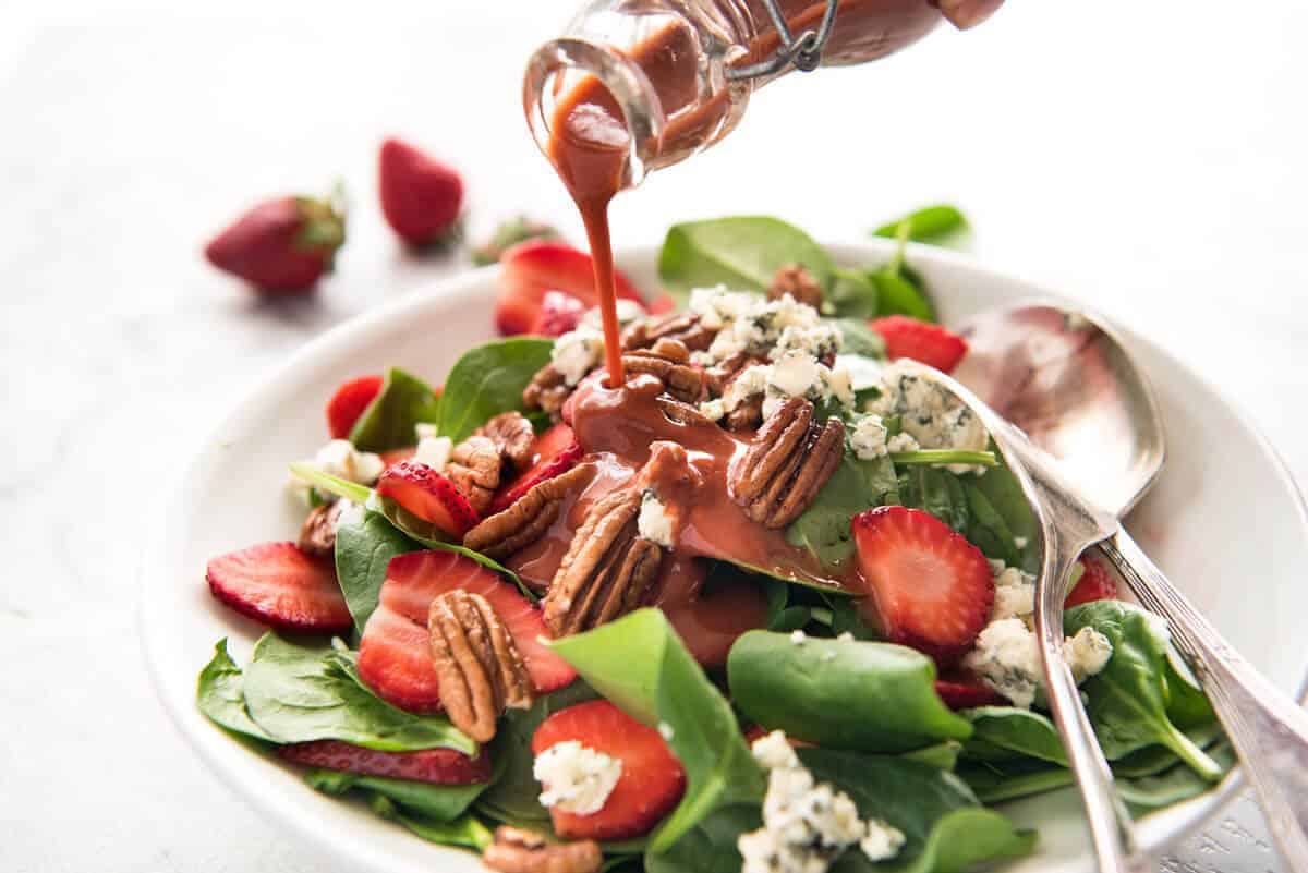 A stunning Chef recipe for a Strawberry Spinach Salad. Spinach, fresh strawberries, blue cheese and candied pecans with a Strawberry Balsamic Dressing. recipetineats.com