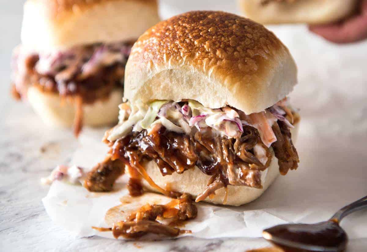 Slow Cooker BBQ Pulled Pork Sandwich - Perfectly seasoned, tender pulled pork tossed in a homemade BBQ sauce, piled onto bread with coleslaw. Slow cooker, pressure cooker or oven. www.recipetineats.com