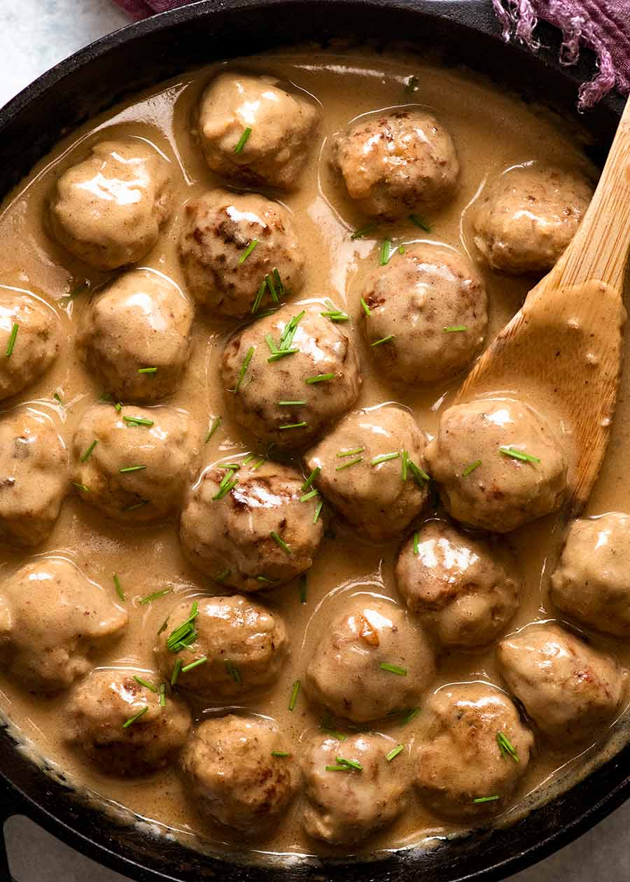 Swedish Meatballs in a skillet with creamy gravy, the traditional Swedish sauce