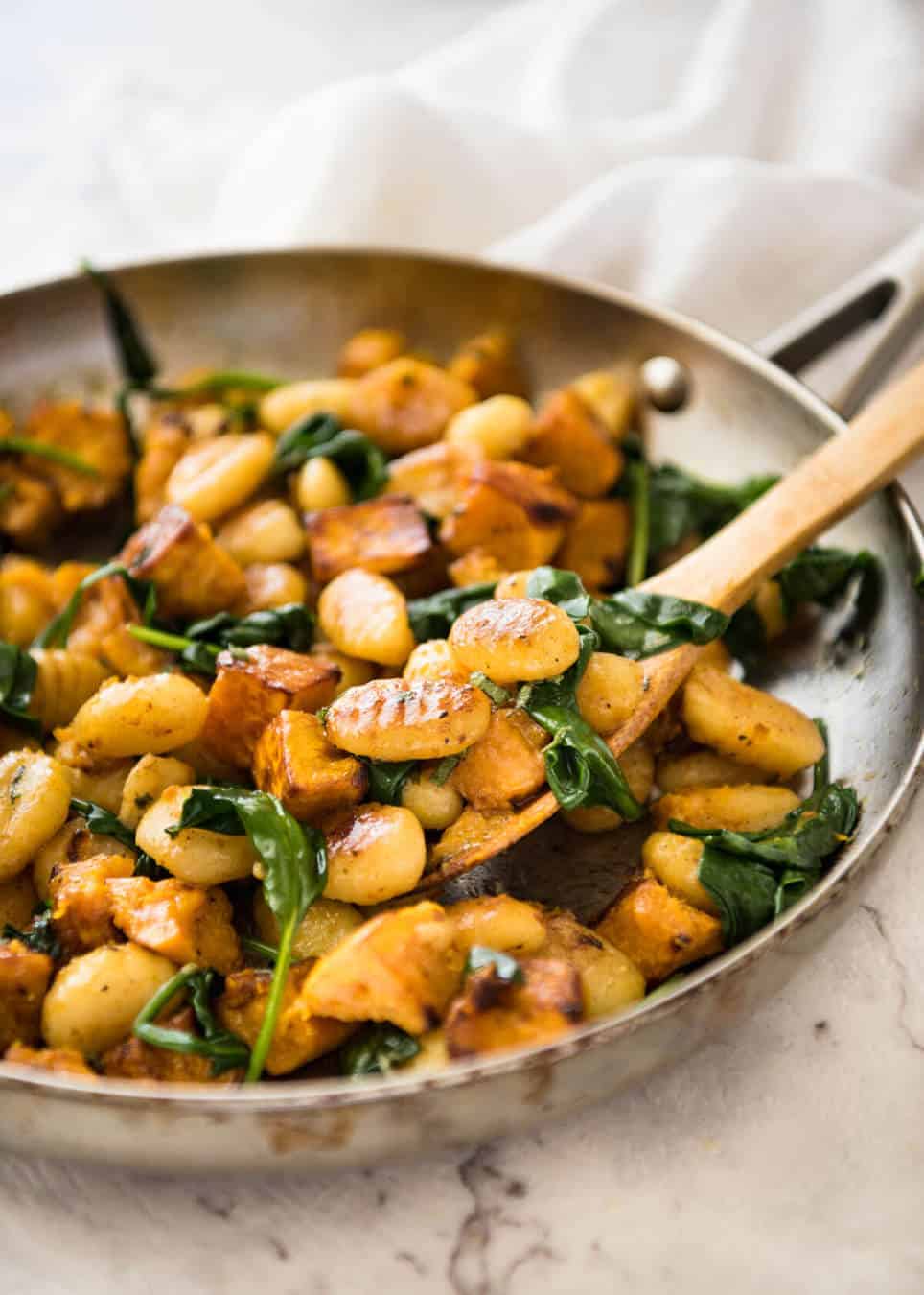 Pan Fried Gnocchi with Pumpkin and Spinach - Golden crispy on the outside, soft on the inside, with a butter sage sauce, roasted pumpkin and spinach. www.recipetineats.com