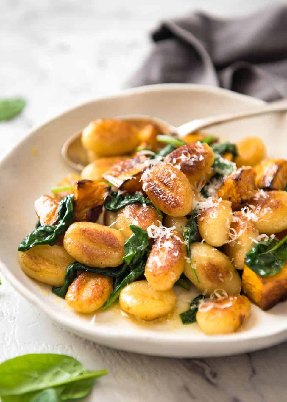 Pan Fried Gnocchi with Pumpkin and Spinach - Golden crispy on the outside, soft on the inside, with a butter sage sauce, roasted pumpkin and spinach. www.recipetineats.com