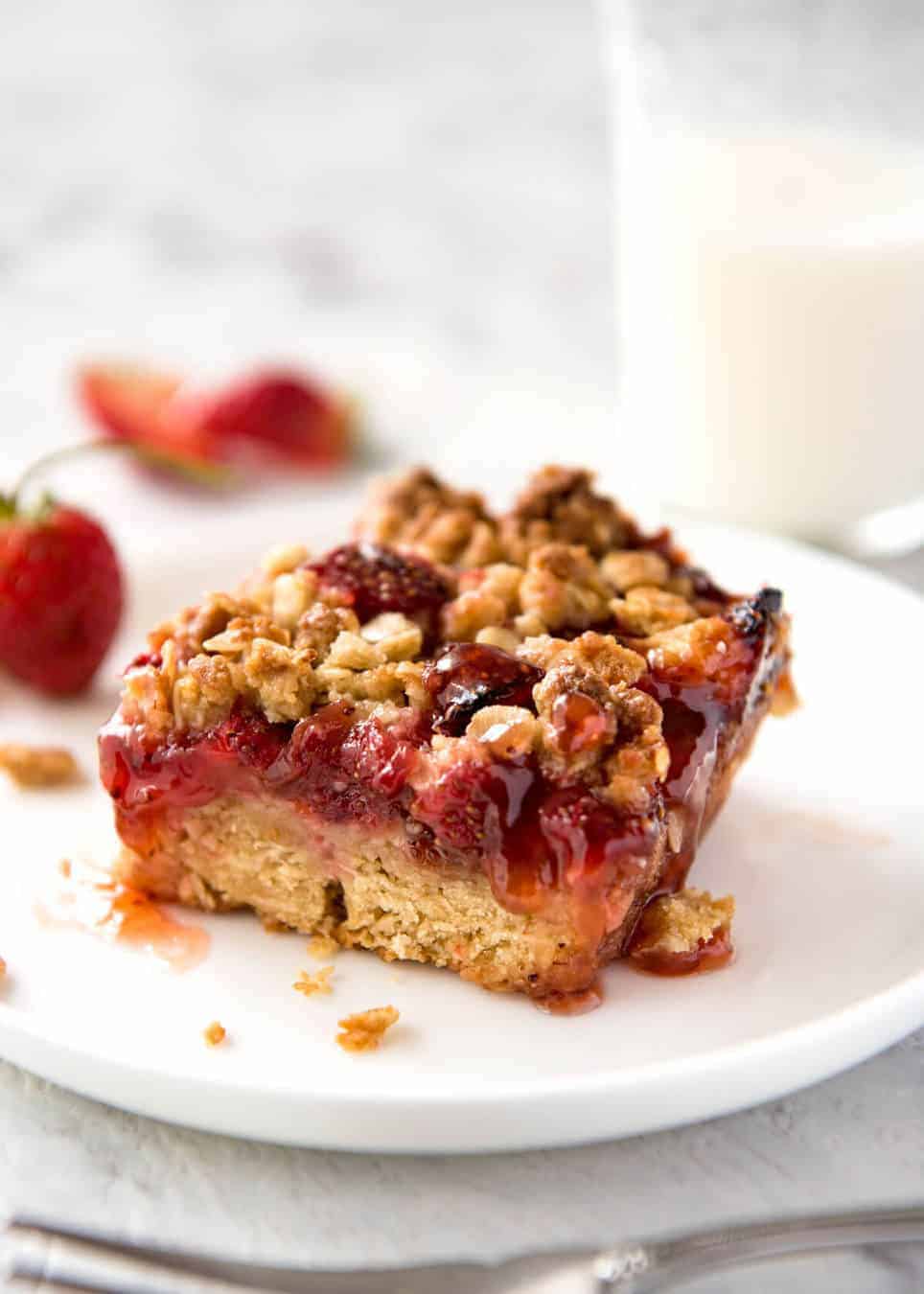 Fresh Strawberry Bars with a buttery biscuit base, topped with jam, fresh strawberries and a crumbly topping. No mixer, quick to make! www.recipetineats.com