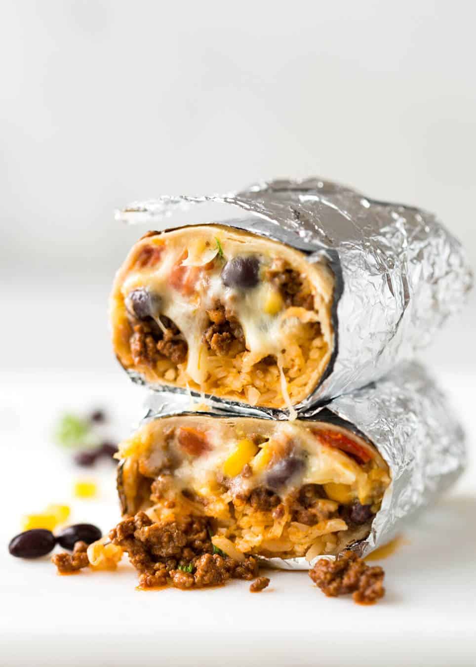 A great everyday Beef Burrito, made with super tasty seasoned beef filling. Fresh and freezable versions! www.recipetineats.com