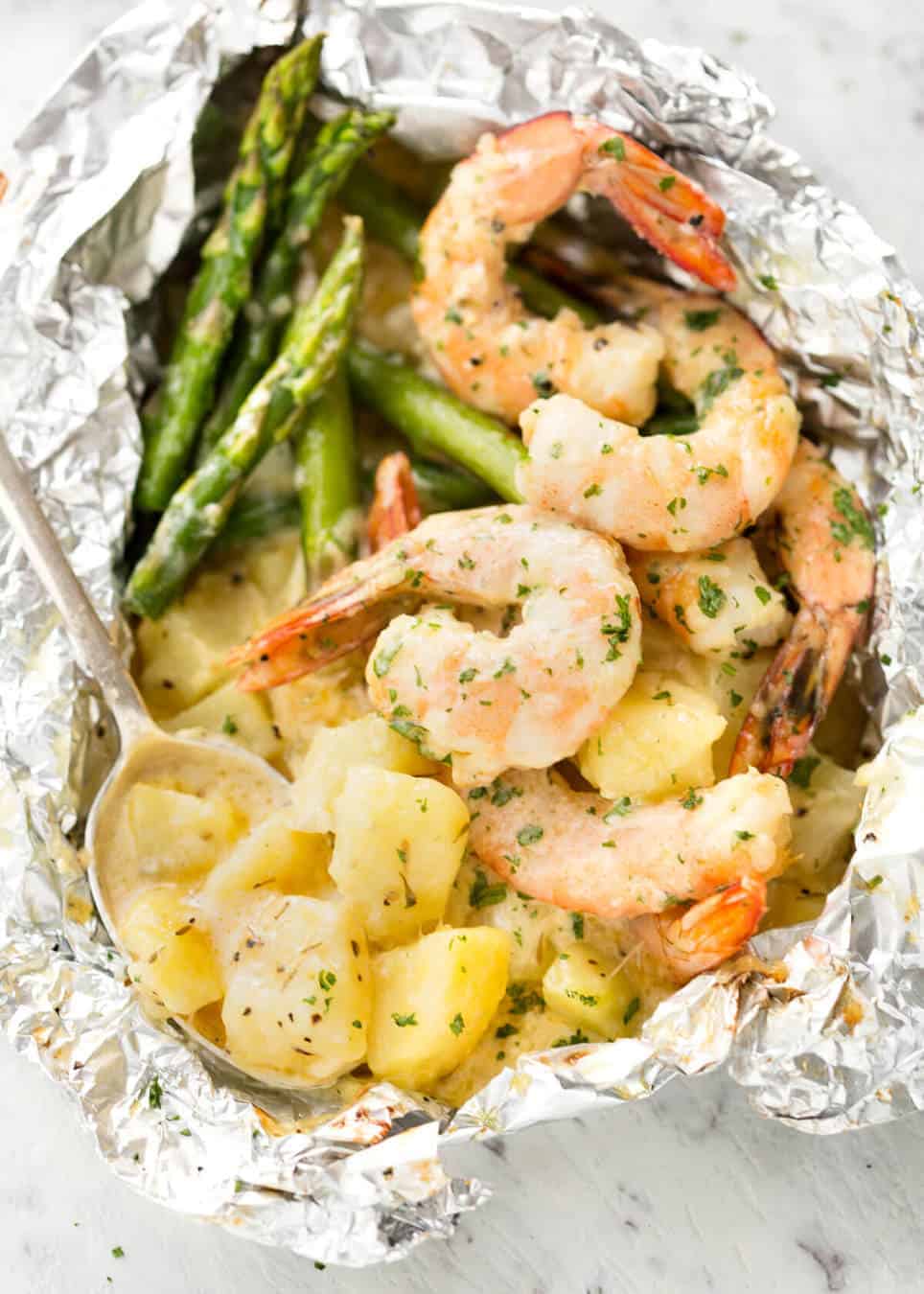 Creamy Garlic Shrimp, Cheesy Potatoes and asparagus - serious contender for the BEST foil packet recipe ever! recipetineats.com