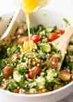 This Israeli Couscous Salad is fabulously addictive! Tender, flavour infused beads of couscous tossed with spinach, tomato, cucumber, herbs and a fresh lemon dressing. Summer in a bowl! recipetineats.com
