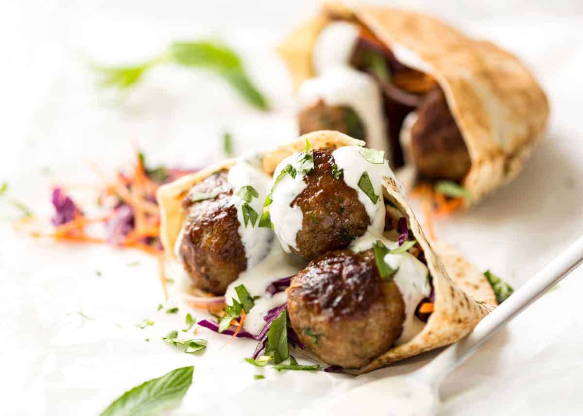Plump, juicy, beautifully spiced Moroccan Lamb Meatballs with Minted Yoghurt. Great for stuffing in pita pockets! www.recipetineats.com