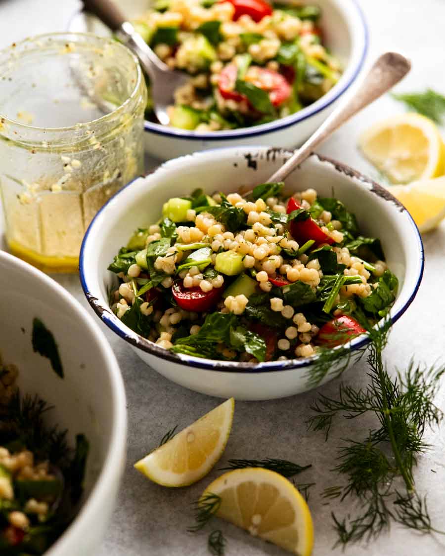 Pearl couscous salad in bowls, ready to be eaten
