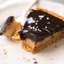 A sinfully decadent Salted Caramel Tart with a creamy soft salted caramel filling topped with luxurious chocolate ganache. Just SIX ingredients! recipetineats.com
