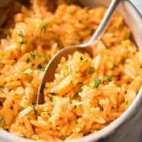 Fluffy, beautifully seasoned Mexican Red Rice (Arroz Rojo). Truly like what you get at restaurants! recipetineats.com