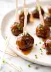 Plump, juicy and soft, these Party Cocktail Meatballs are baked and served with a fabulous Sweet & Sour Dipping Sauce that's super quick to make. Great make ahead for parties! recipetineats.com