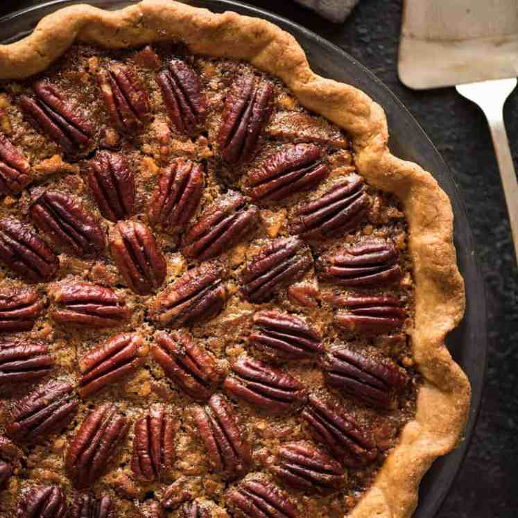 Learn how to make Pecan Pie, the great American classic! Flaky all-butter pie crust with a soft set filling, the quick video tutorial will be very helpful will guide you to nail this every time! recipetineats.com