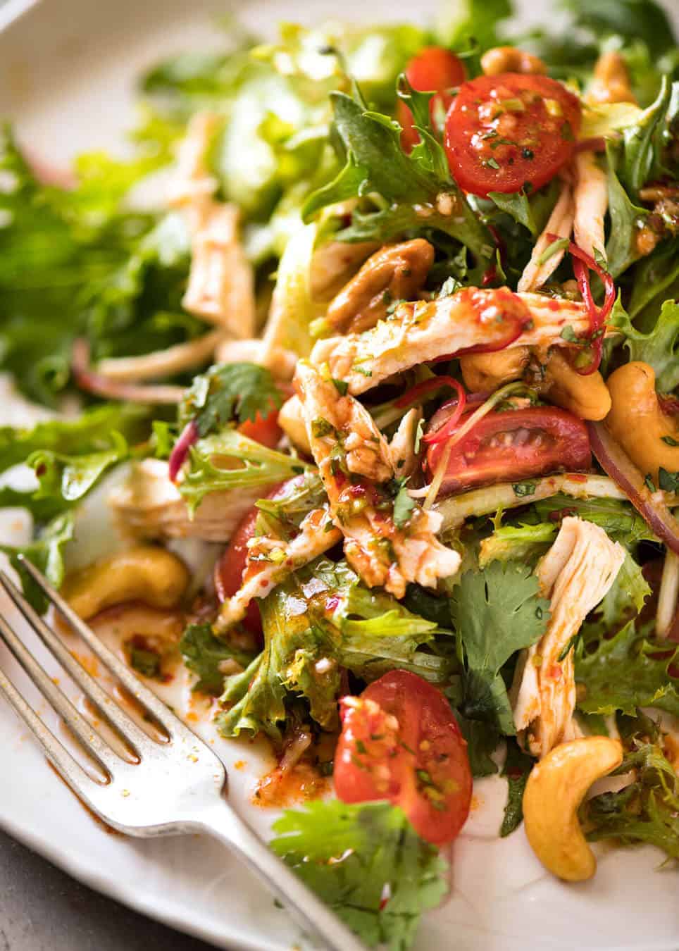 Thai Chicken Salad with a bright zesty Chilli Lime Dressing, classic balance of Thai tangy-sweet-salty flavours. recipetineats.com