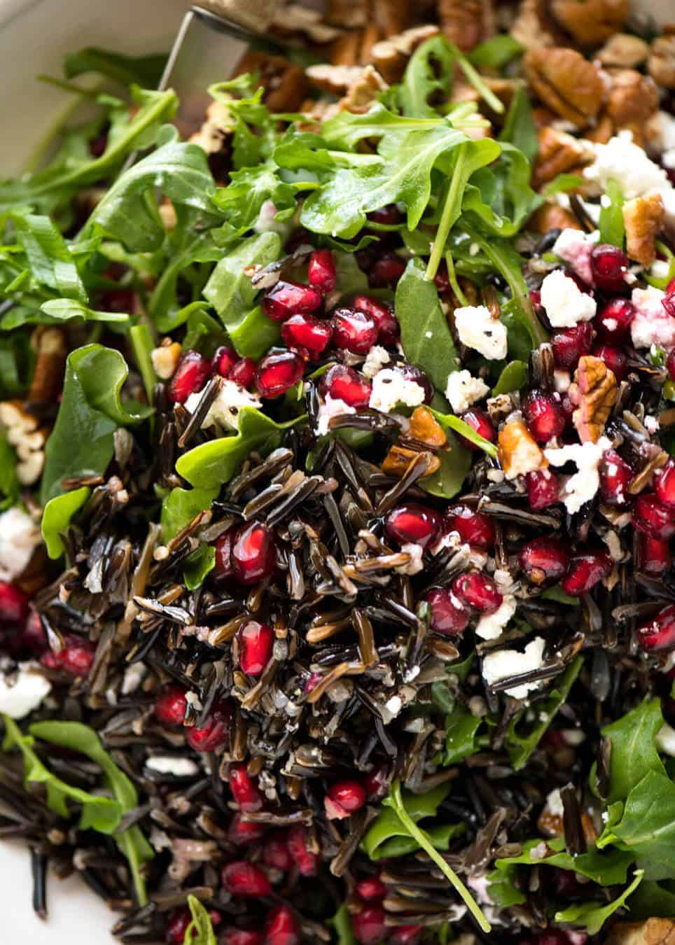 This Wild Rice Salad is a salad for celebrations! Stellar flavour combination - wild rice, pomegranate, pecans, rocket / arugula, green onions, cranberries and feta. www.recipetineats.com