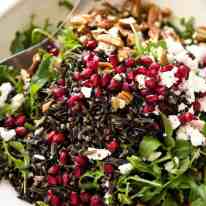 This Wild Rice Salad is a salad for celebrations! Stellar flavour combination - wild rice, pomegranate, pecans, rocket / arugula, green onions, cranberries and feta. recipetineats.com