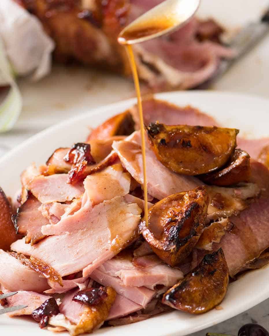 Drizzling sauce over Maple Glazed Ham