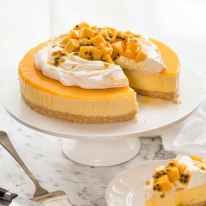 Mango Cheesecake on a cake platter, ready to be served