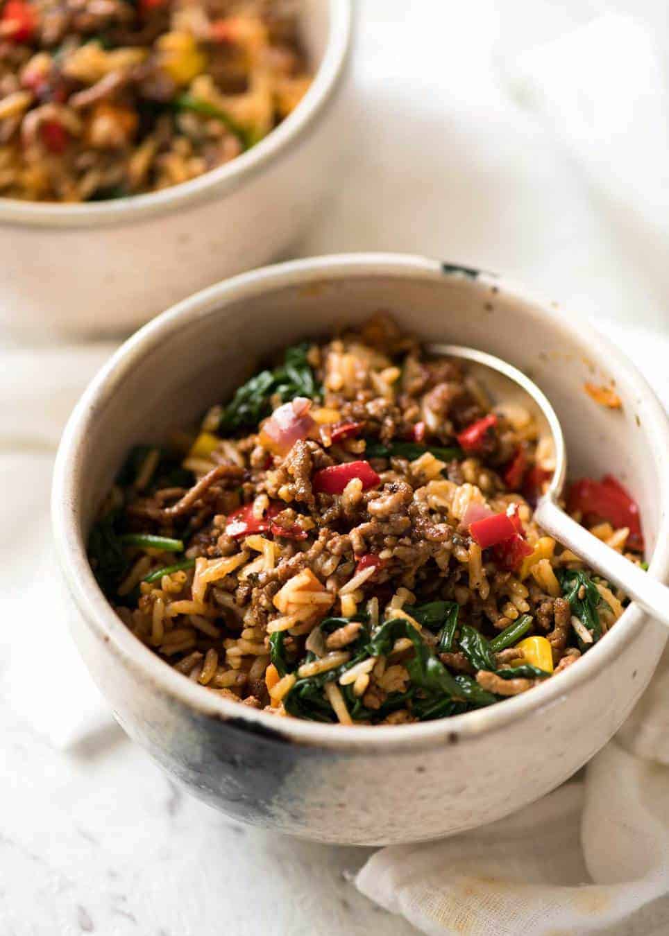 A quick, fabulous midweek meal - this ground Beef and Rice is made by browning ground beef, then cooking it with flavoured rice and loads of veggies. Irresistibly delicious! www.recipetineats.com