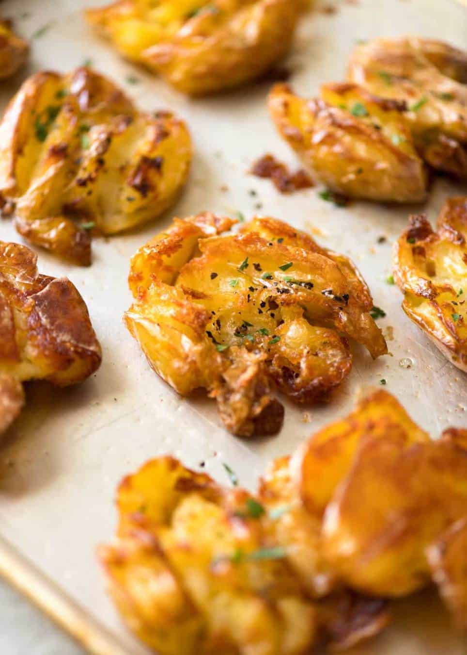 The best, buttery, golden, ultra crispy smashed potatoes you will ever have! www.recipetineats.com