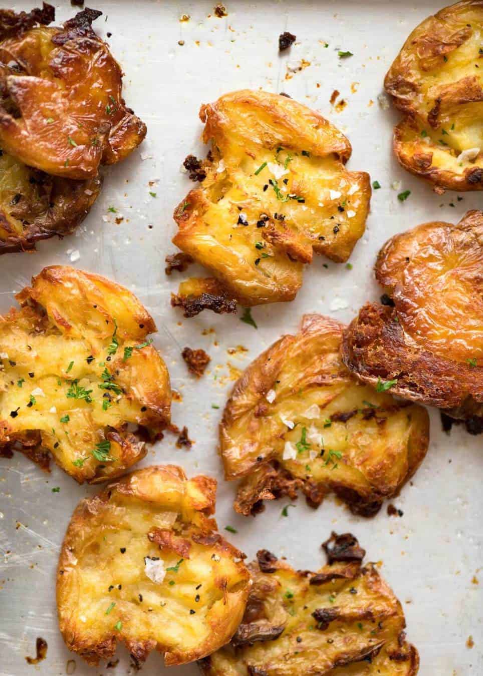 The best, buttery, golden, ultra crispy smashed potatoes you will ever have! www.recipetineats.com