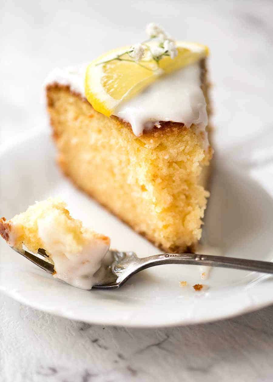 Slice of Lemon Cake on a plate with a fork, ready to be eaten