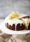Lemon Yoghurt Cake with Drippy Lemon Glaze on a cake stand