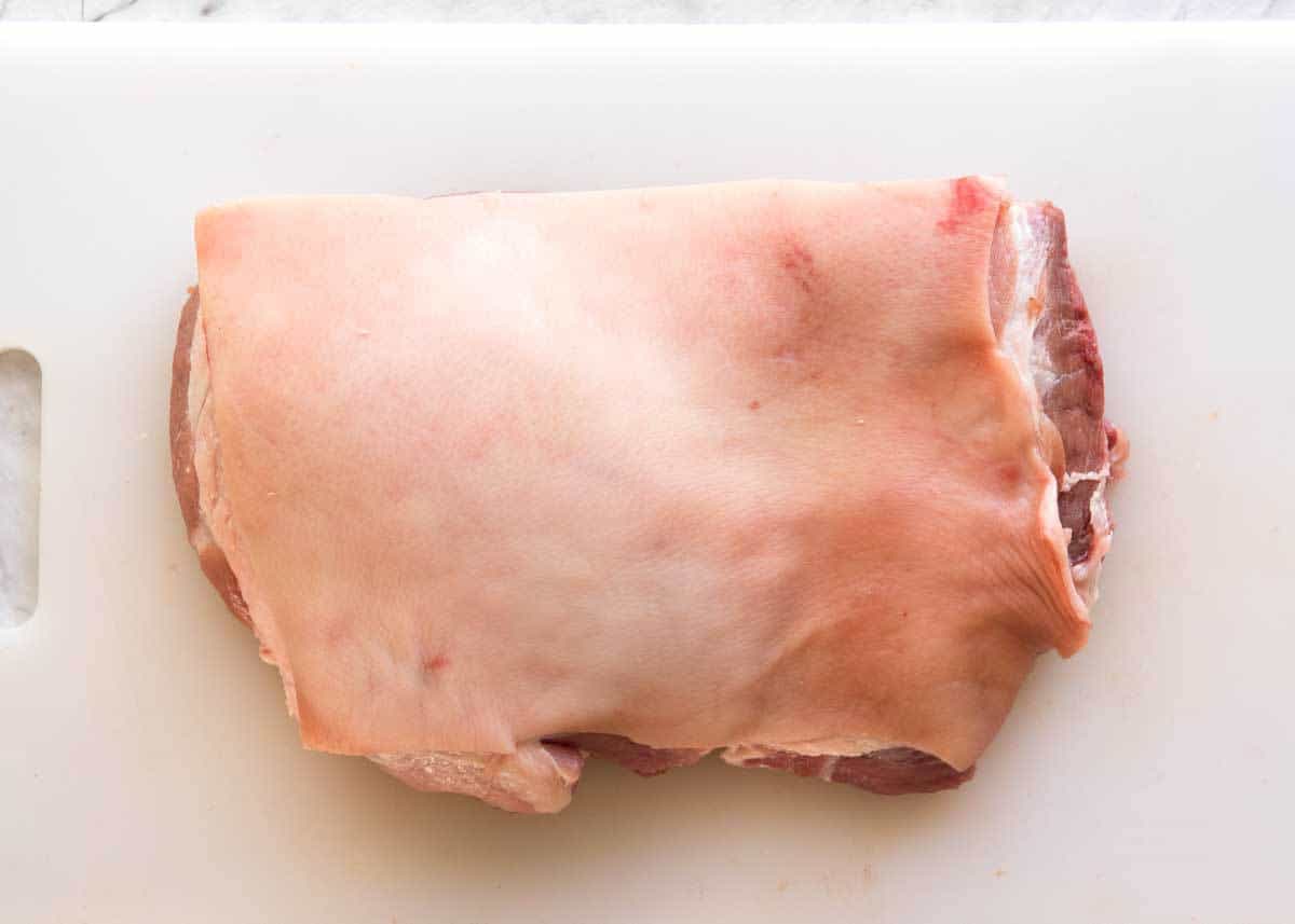 Raw pork shoulder with skin on, no scoring