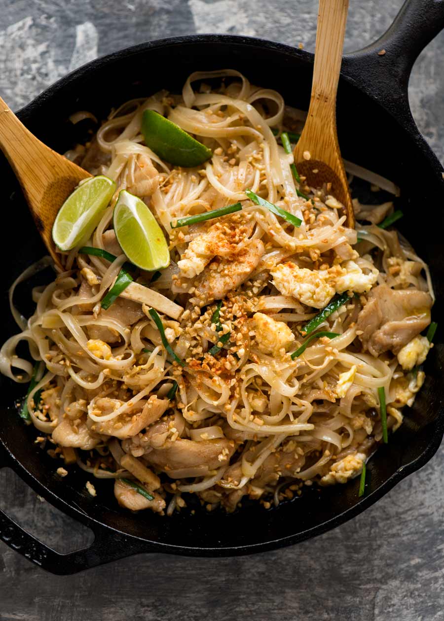 Chicken Pad Thai in a black skillet, fresh off the stove, ready to be served.