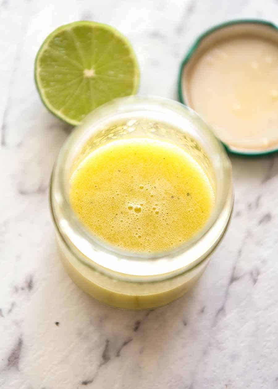 Jar with lime dressing for Mexican Avocado Chicken Salad