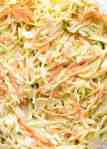 Close up of juicy Coleslaw in a glass bowl