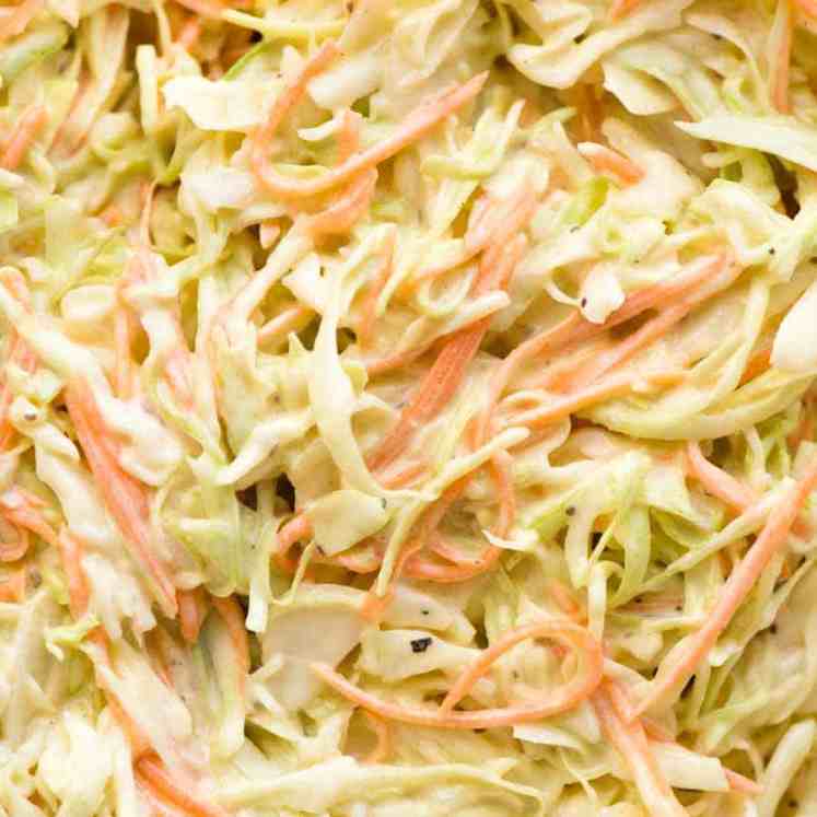 Close up of juicy Coleslaw in a glass bowl