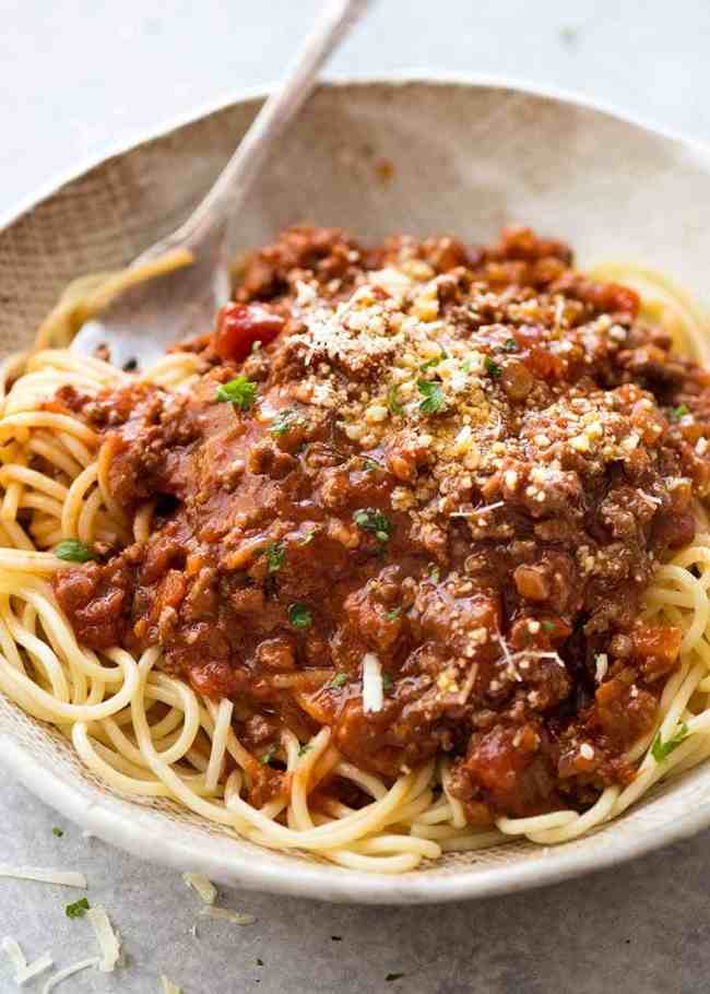 Quick and easy dinner ideas - image of a bowl of spaghetti bolognaise mince and noodles with Parmesan sprinkled on top