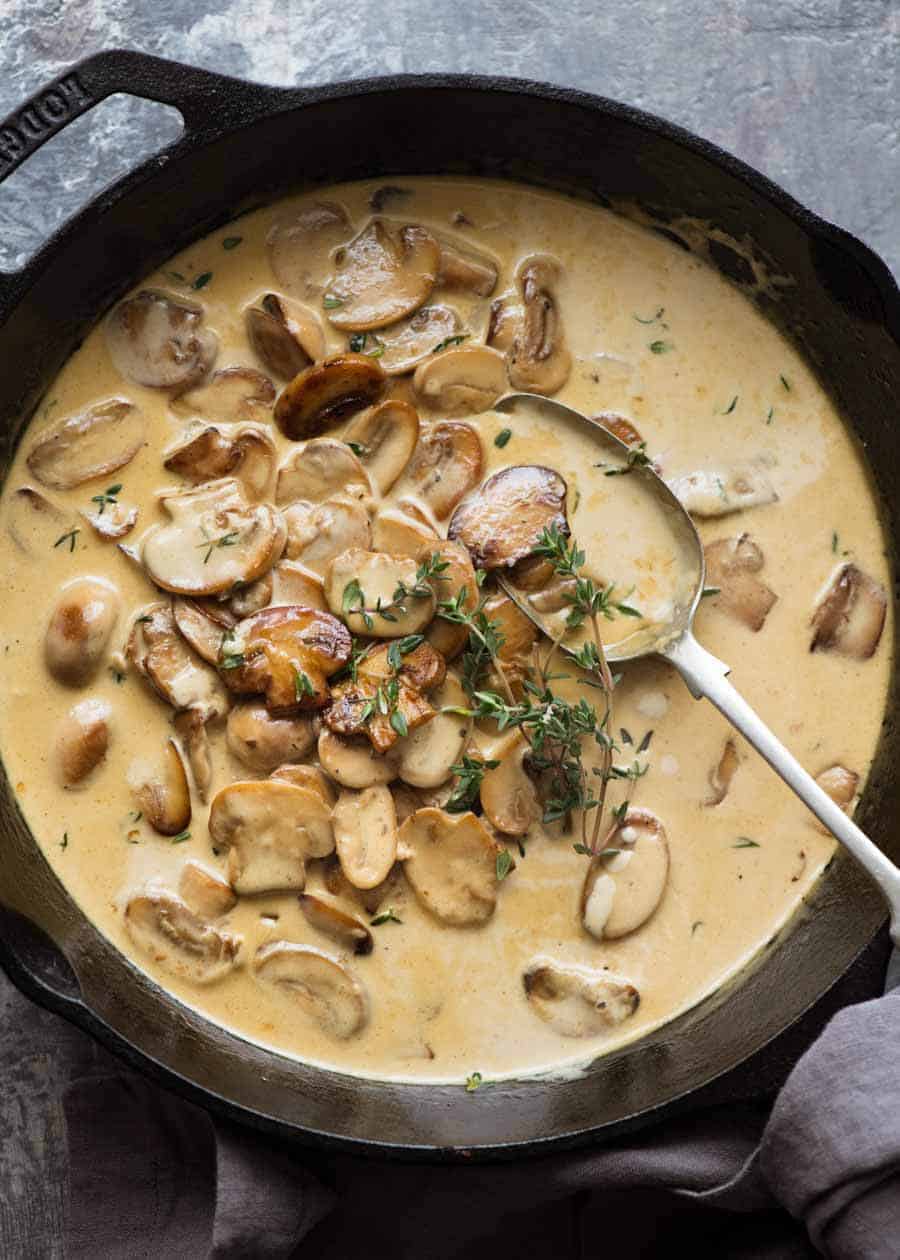 Overhead of Creamy Mushroom Sauce in a black skillet, fresh off the stove