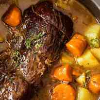 Slow cooker roast in a slow cooker, ready to eat