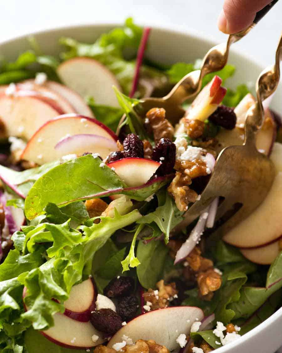 Tossing Apple Salad with Candied Walnuts and Cranberries