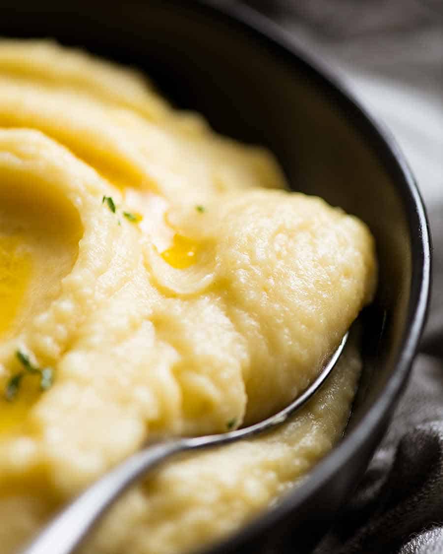 Close up of Paris Mash (Rich & Creamy Mashed Potato) being scooped up with a spoon