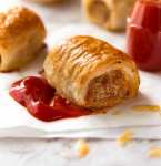 Close up of Sausage Rolls with tomato sauce
