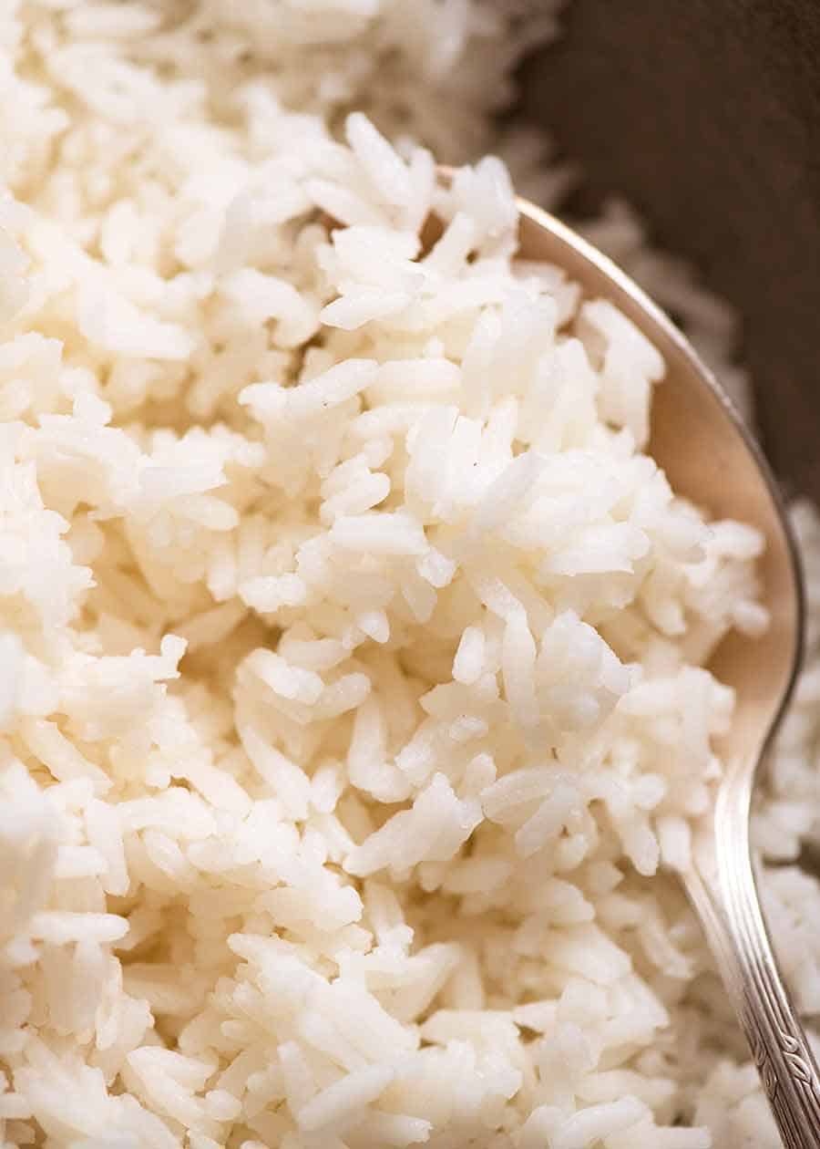 Close up photo of perfect fluffy rice cooked on the stove