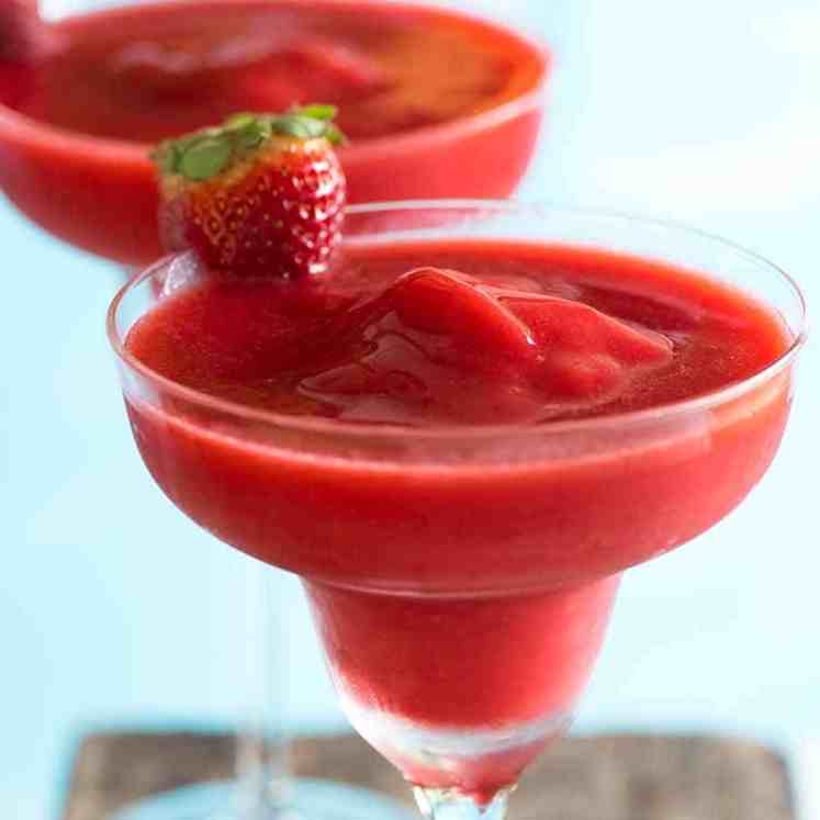 Close up of Frozen Strawberry Daiquiris by the pool - best summer cocktail!