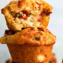 Stack of 3 Mediterranea Savoury Muffins - cheesy muffins with olives, sun dried tomatoes, roasted peppers, feta and cheese