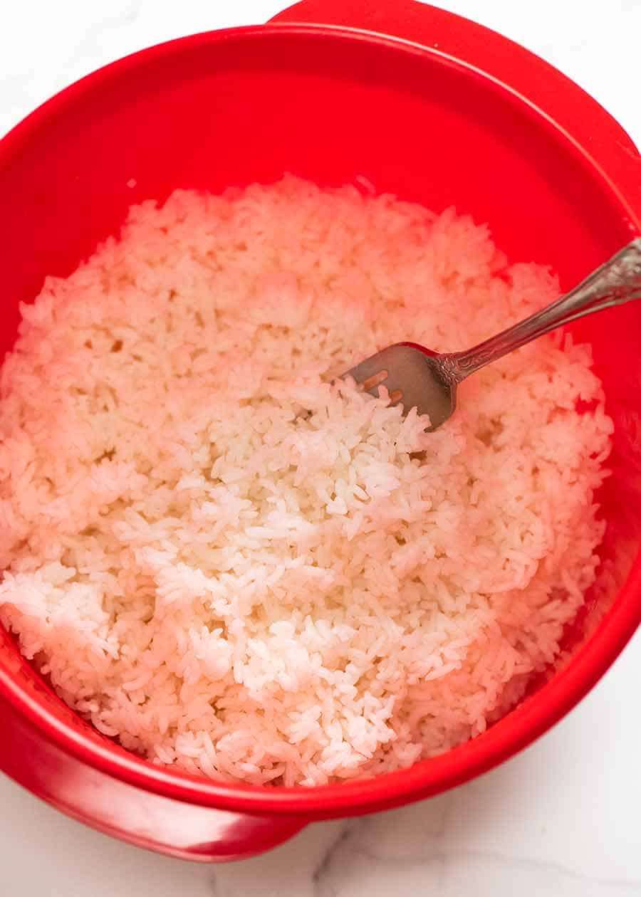 Rice cooked in the microwave in a container