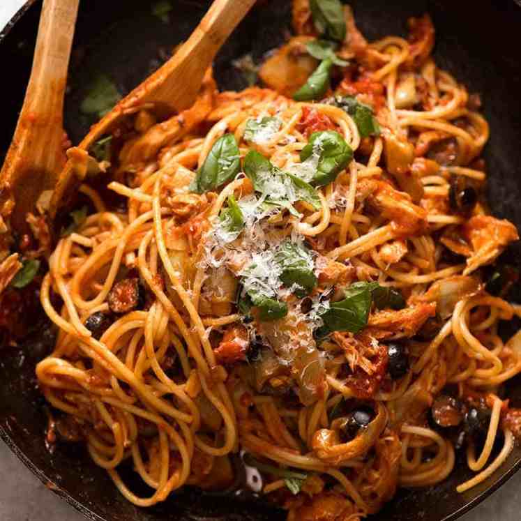 Sicilian Chicken Spaghetti in a black skillet, ready to be serced
