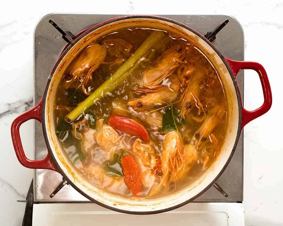 Pot of Tom Yum Soup broth simmering on the stove
